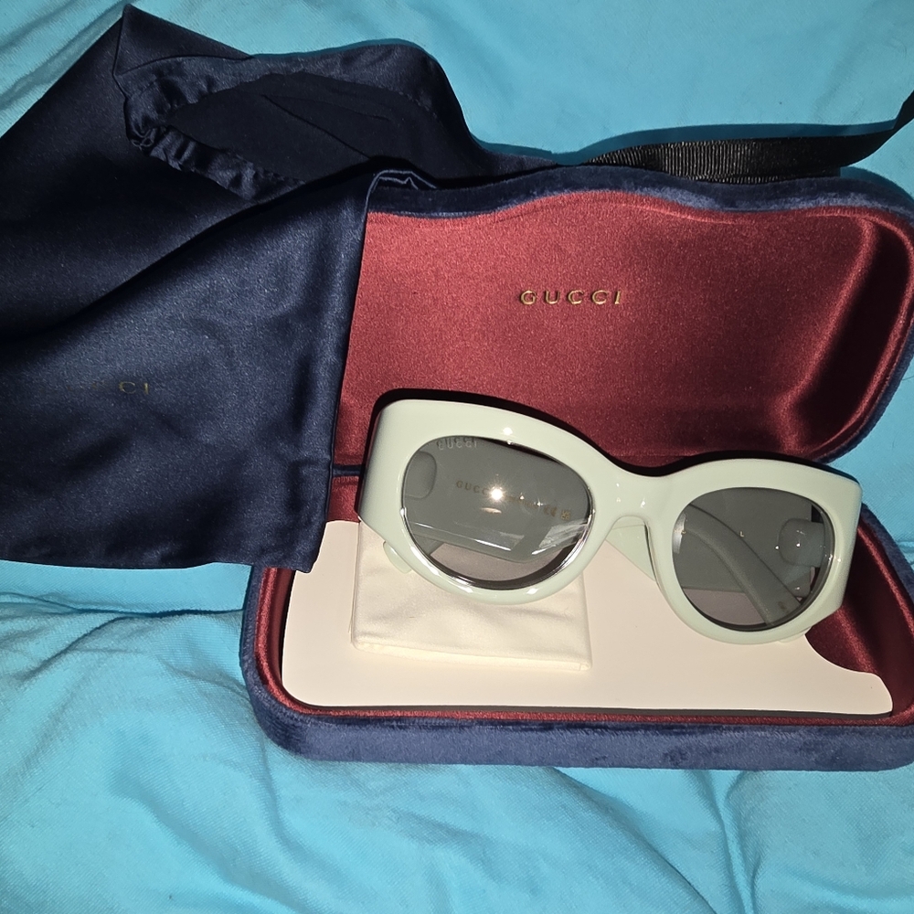 Gucci new with case dust bag and cleaning cloth